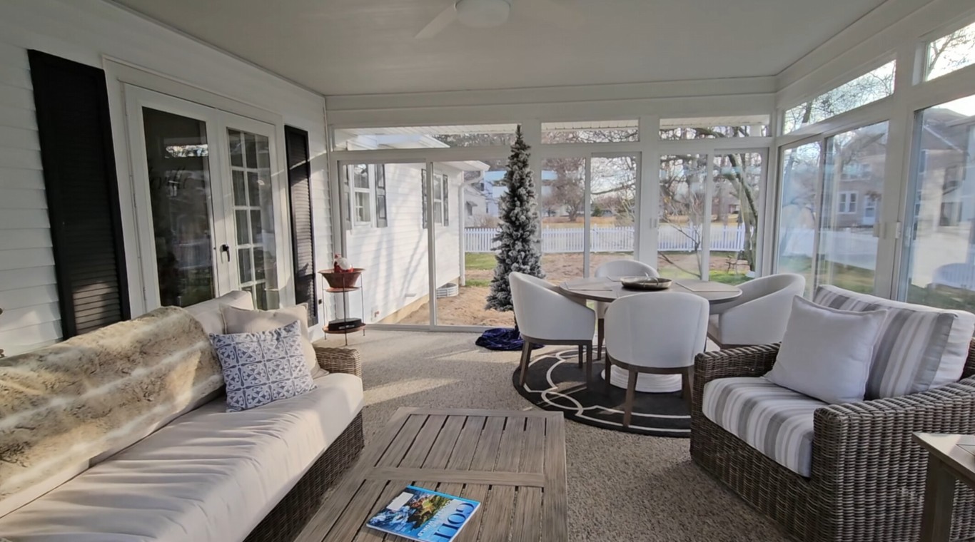 Energy-efficient sunroom interior with comfortable white furniture in Temecula home